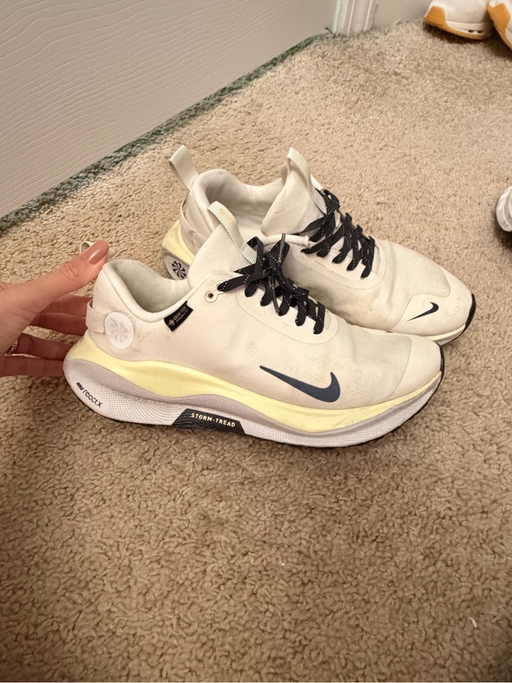 Nike Women's White Sneakers with Yellow Accent and Black Swoosh